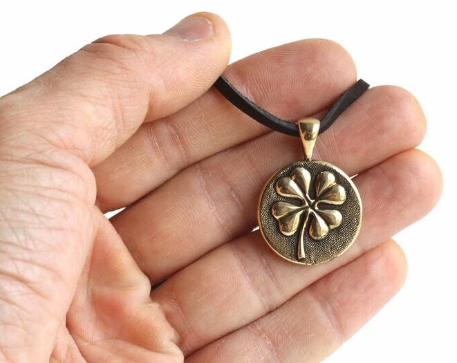The amulet four-leaf clover brings good luck and love
