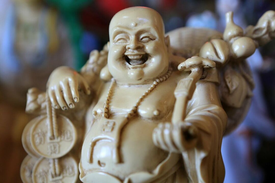 amulet of health and well-being of the family - a smiling Buddha
